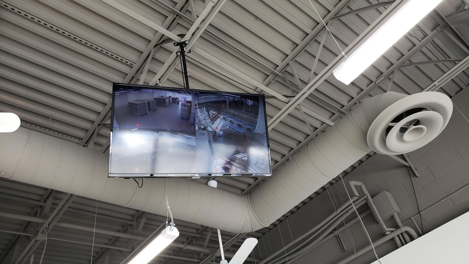 Ceiling-mounted security camera with monitoring display